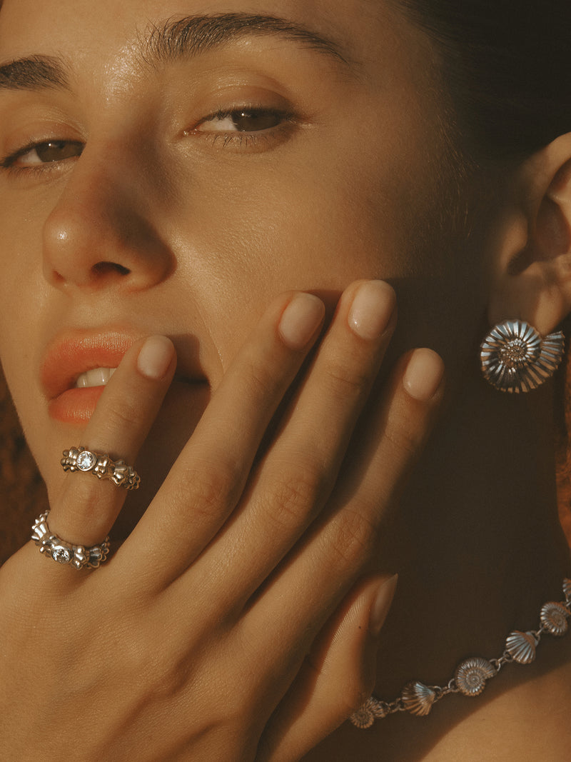 The Power of Love Ring in 18k yellow and white gold by Pola Jewellery—sculptural pinky ring with lab-grown diamond, symbolizing love.