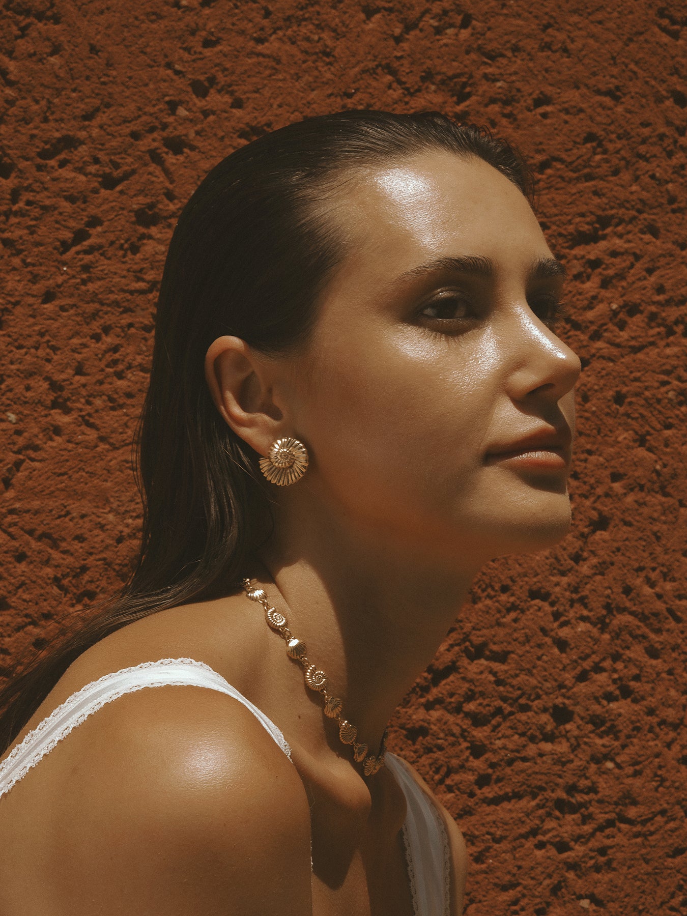 The Power of Love Earrings in gold vermeil by Pola Jewellery—nautilus-inspired shells symbolizing love, balance, and refined strength.