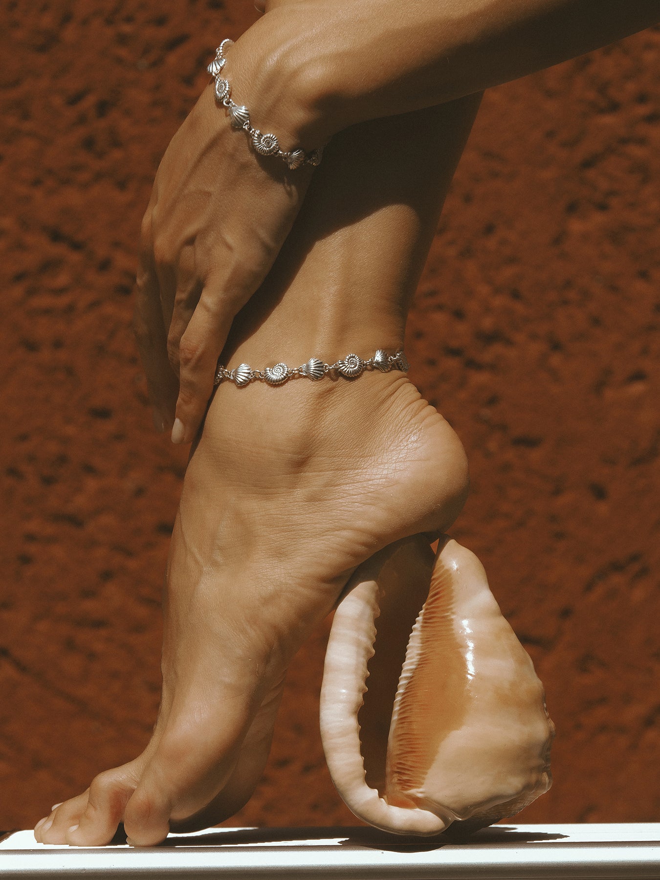AMOR Anklet in sterling silver by Pola Jewellery—shells and spirals symbolizing eternal love, movement, and summer energy.