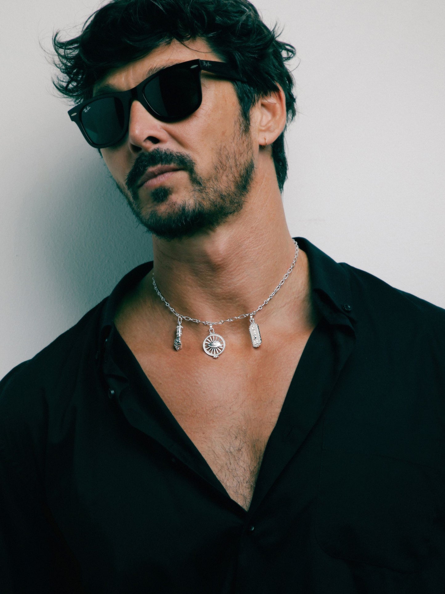 Sterling silver Talisman Necklace by Pola Jewellery with Mano Figa, Evil Eye & Chill—gender-neutral symbols of power & protection.