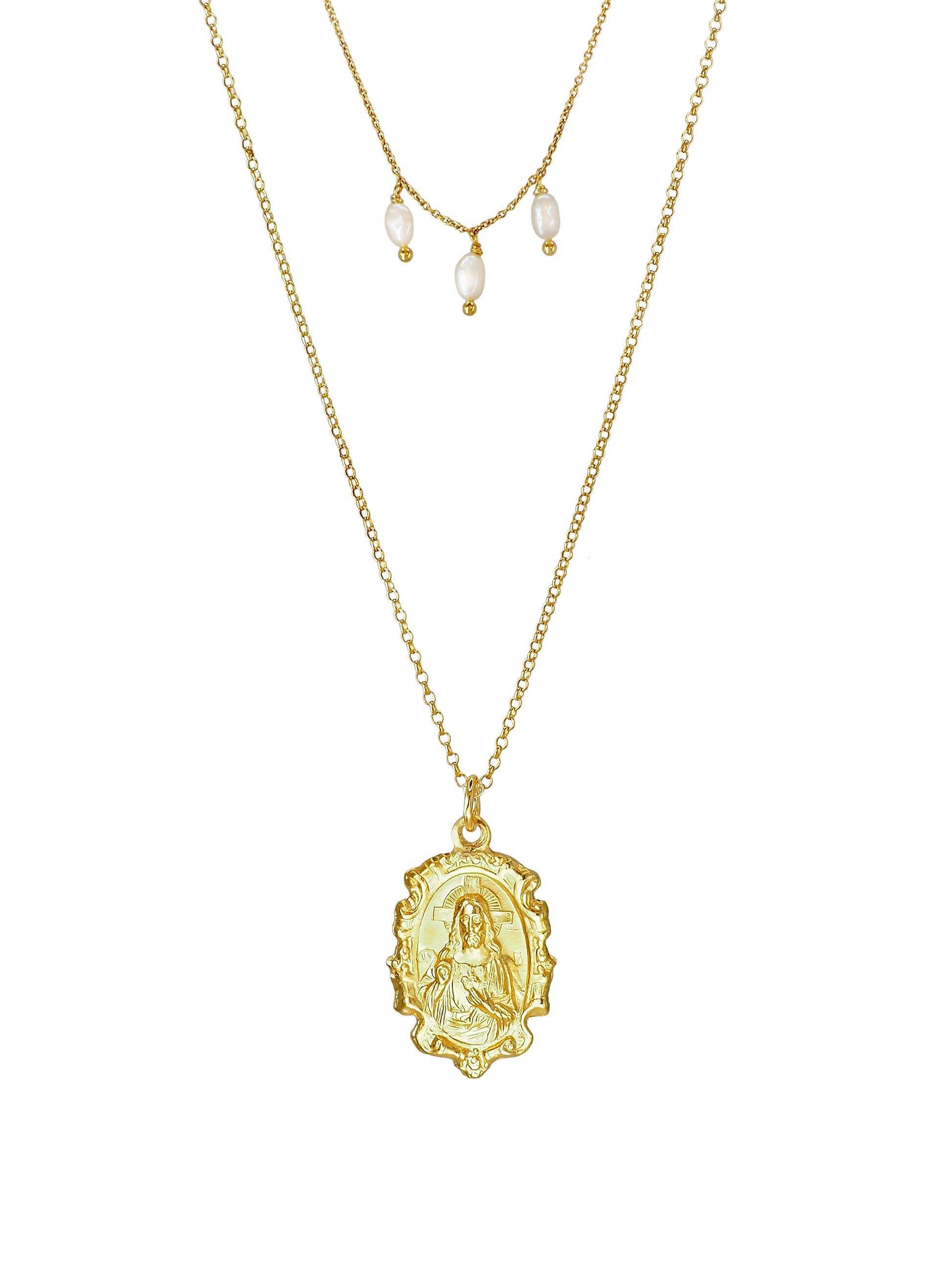 Close-up of Our Lady of Carmen pendant with Sacred Heart on gold-plated sterling-silver double-chain necklace with pearls.