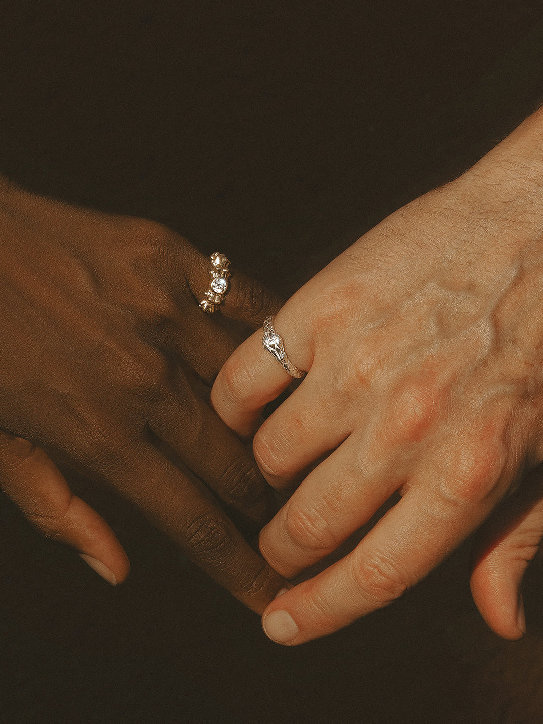 Unique wedding rings by Pola Jewellery — Ouroboros Ring in 18k white gold as a men's wedding band, paired with the Power of Love diamond ring, gender-neutral handcrafted jewellery designed in Mallorca.