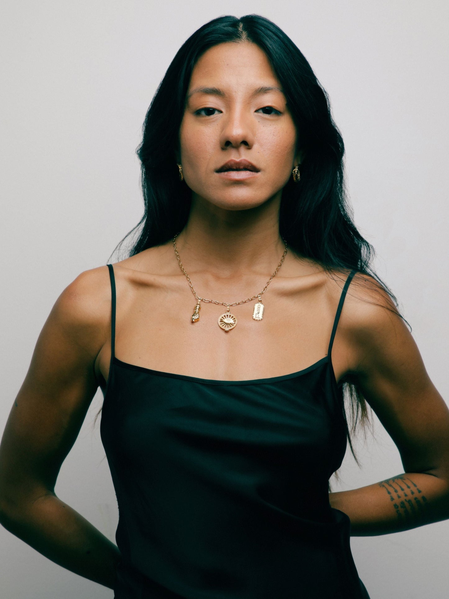Gold vermeil Talisman Necklace by Pola Jewellery with Mano Figa, Evil Eye & Chill—symbols of protection & power.