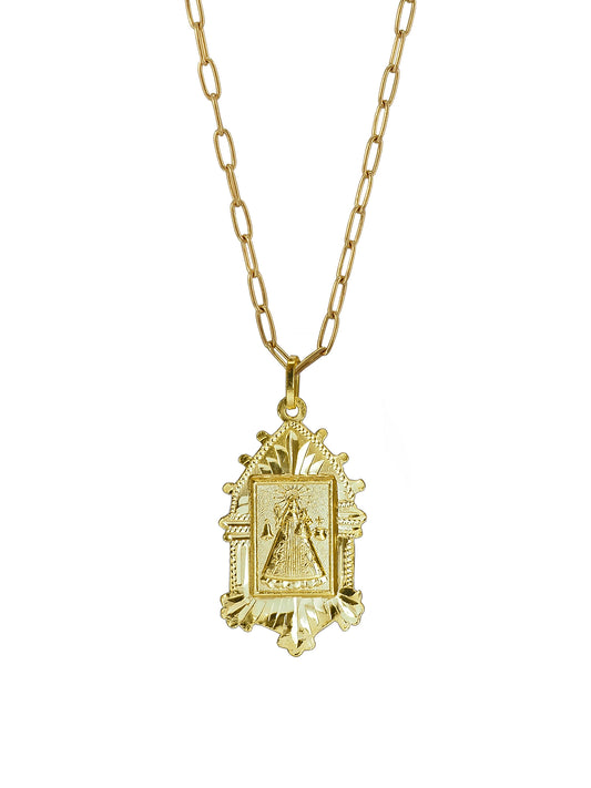 Close-up of Pola Jewellery’s Vintage Madonna of Núria Necklace in gold-plated sterling silver, depicting the patroness of the Pyrenees — a radiant symbol of light and protection.