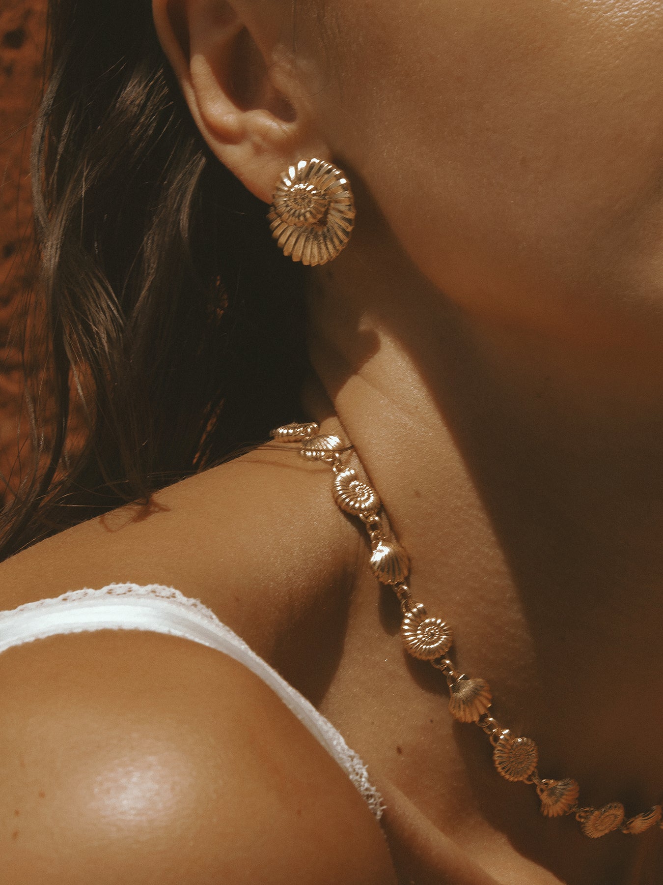 AMOR Earrings in gold vermeil by Pola Jewellery—nautilus-inspired shells symbolizing love, balance, and refined strength.