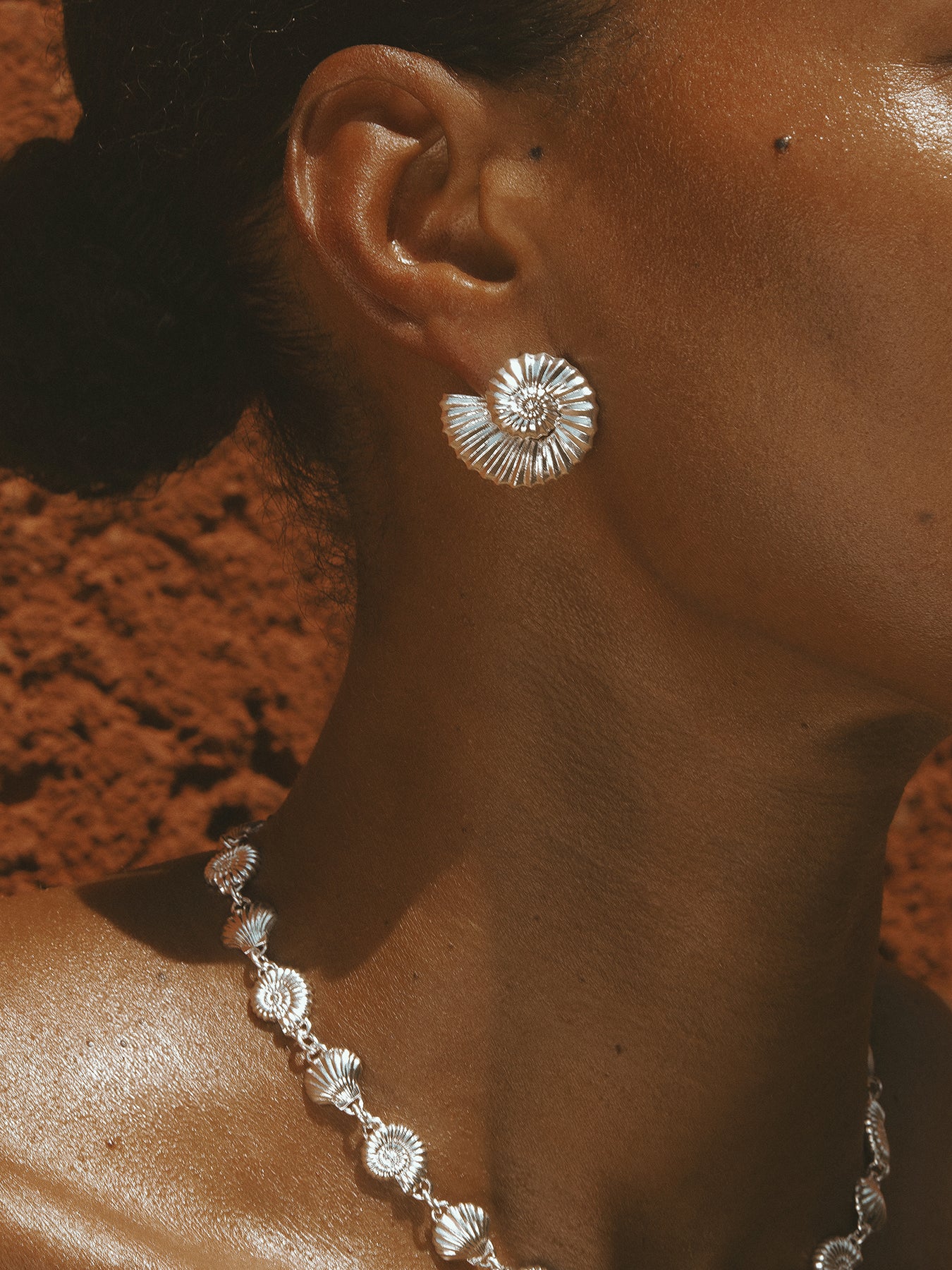 AMOR Earrings in sterling silver by Pola Jewellery—nautilus shell design symbolizing harmony, love, and sculptural elegance.