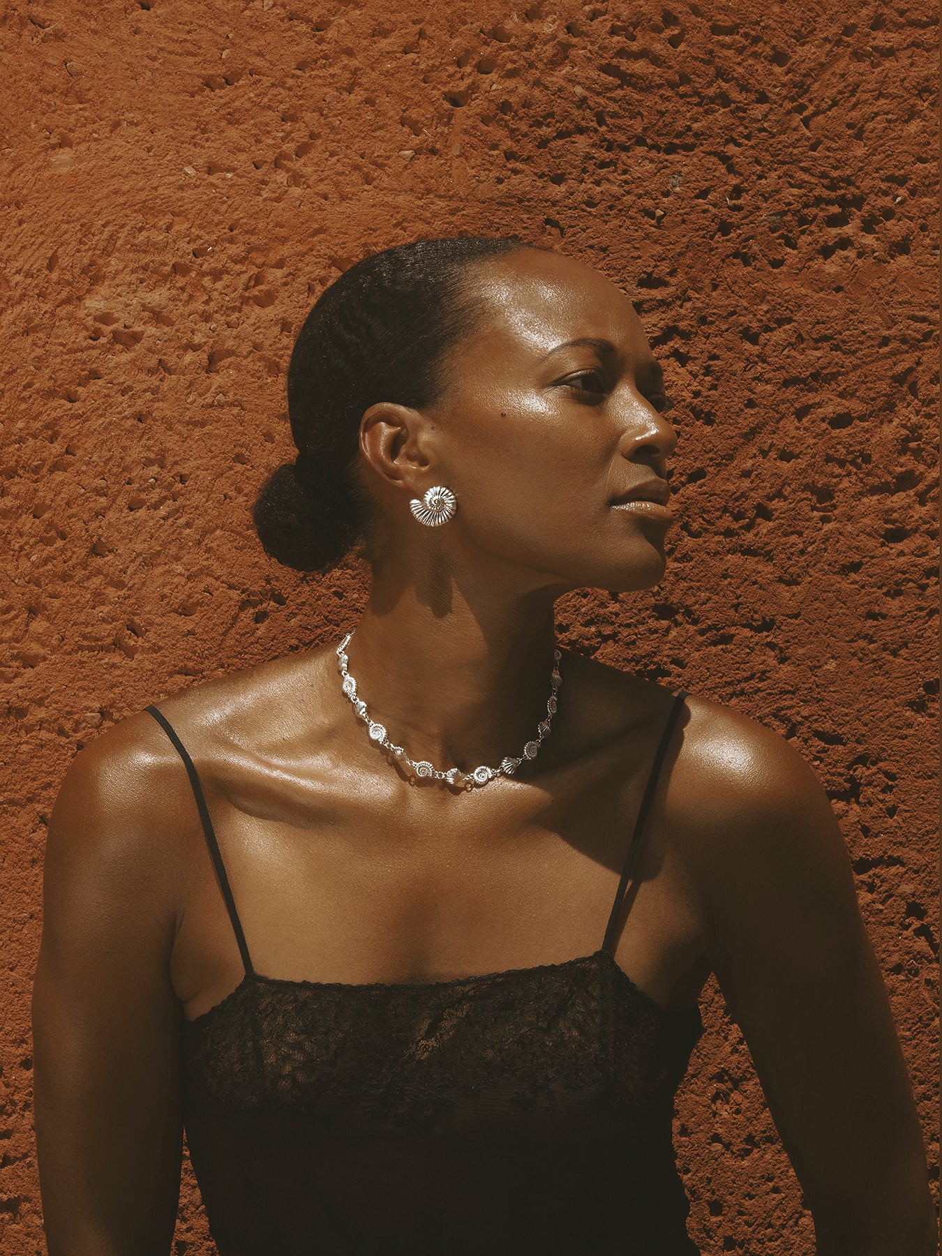 AMOR Earrings in sterling silver by Pola Jewellery—nautilus shell design symbolizing harmony, love, and sculptural elegance.